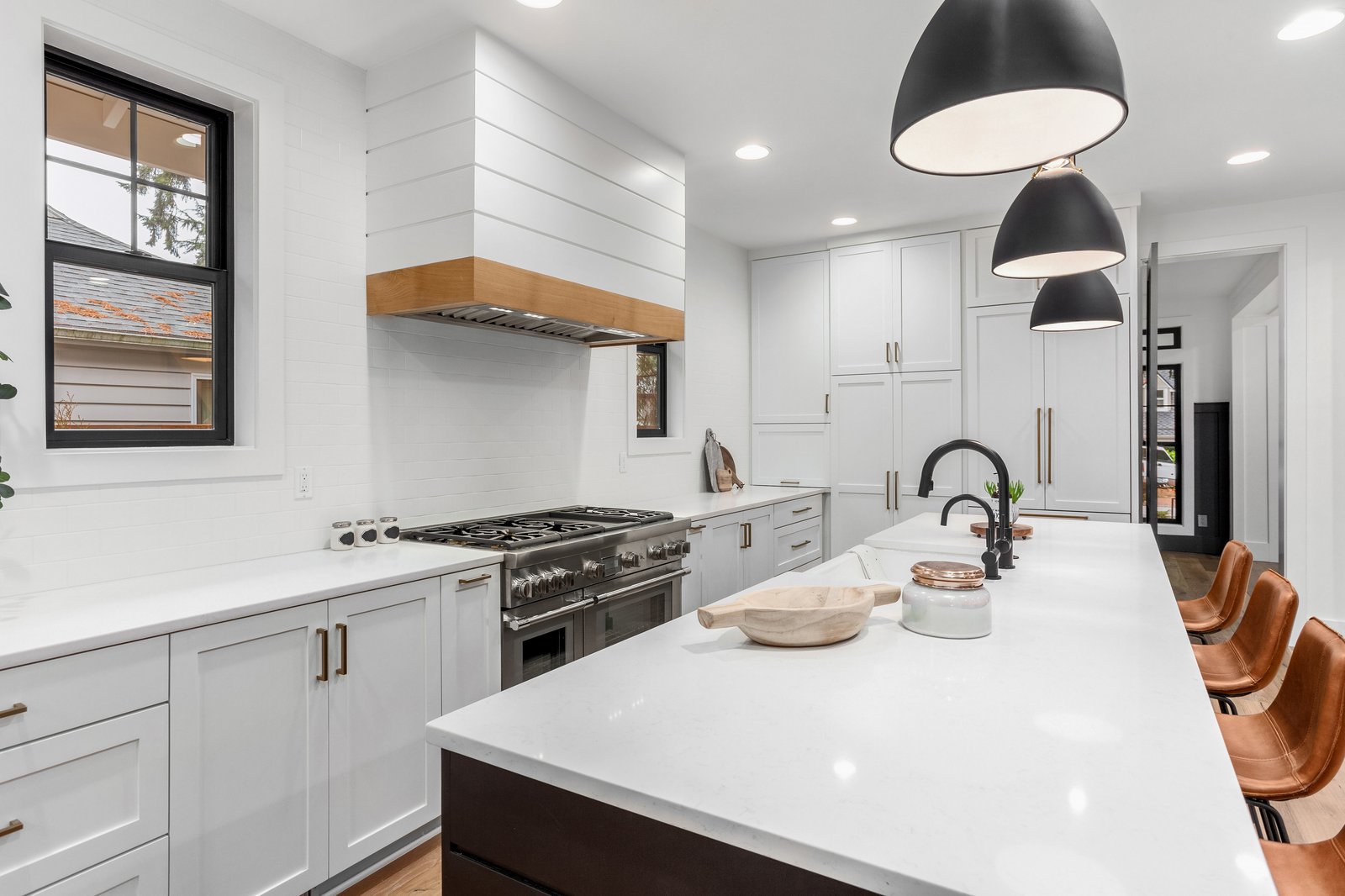 Lakeside + Addition custom kitchen with white cabinets by Reschka Design Build