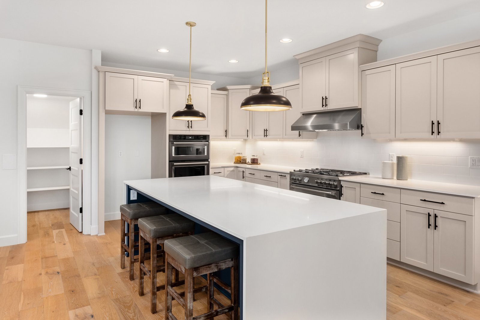Sterling + Modern kitchen island custom home by Reschka Design Build